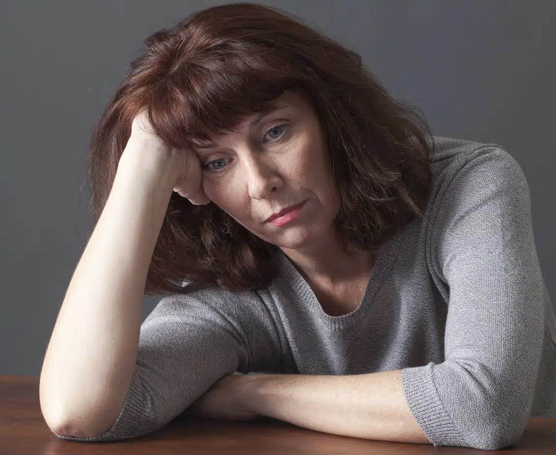 Overwhelmed woman suffering from menopause